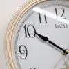 A simple wall-mounted clock with a golden frame for the living room and bedroom, featuring silent hands Application Scenario